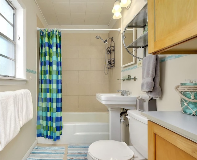 bathroom featuring shower / bath combo and toilet