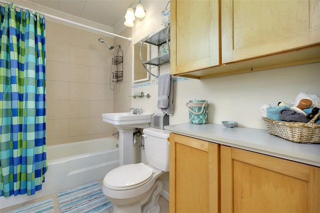 bathroom featuring shower / tub combo and toilet