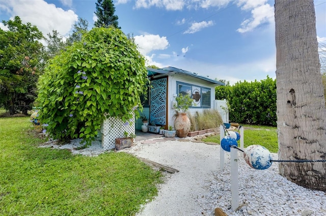 view of home's exterior with a yard