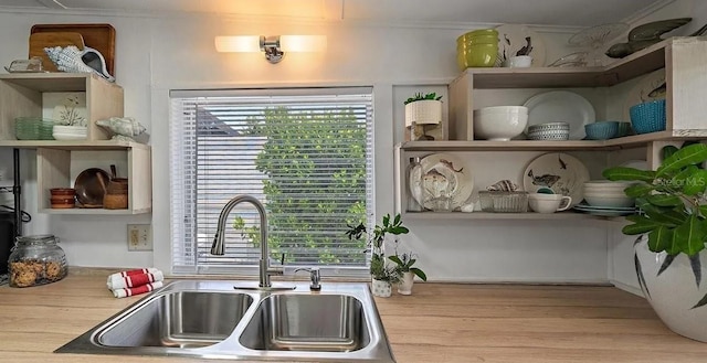 kitchen with light hardwood / wood-style flooring and sink