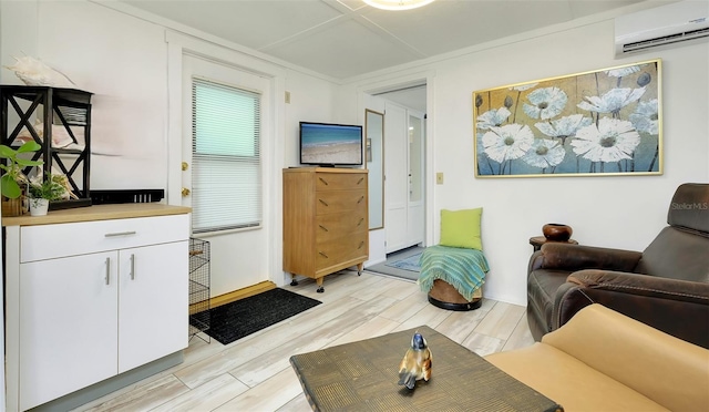 living room with an AC wall unit and light wood-type flooring