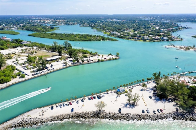 bird's eye view with a water view and a beach view