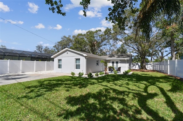 rear view of house with a yard