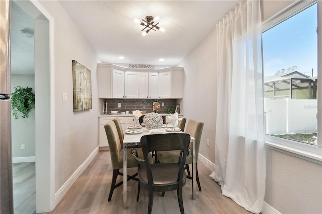 dining area with light wood-type flooring