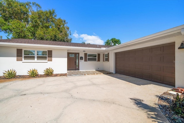 ranch-style house featuring a garage