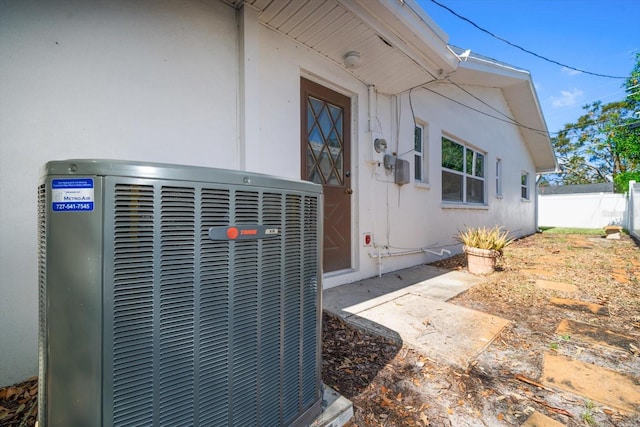 doorway to property featuring central AC unit