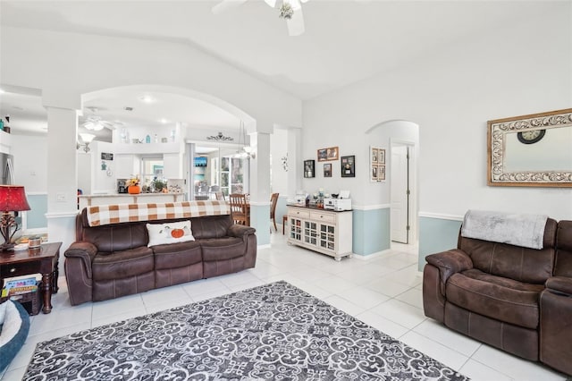 tiled living room featuring lofted ceiling and ceiling fan