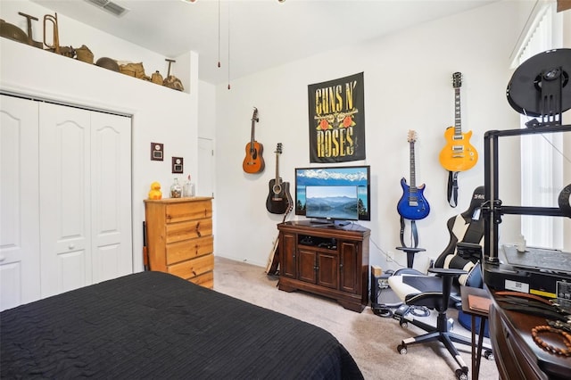 carpeted bedroom featuring a closet