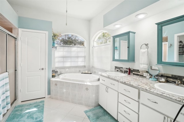 bathroom with vanity, plus walk in shower, and tile patterned floors