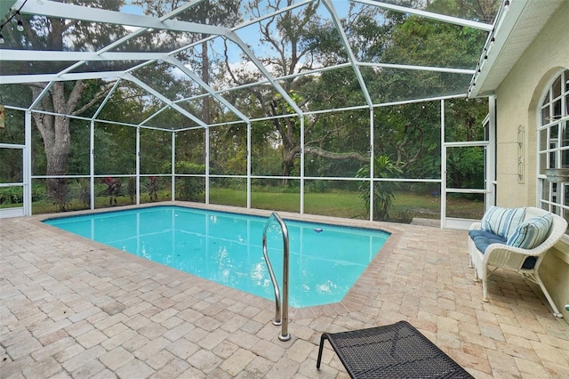 view of pool featuring a patio and a lanai