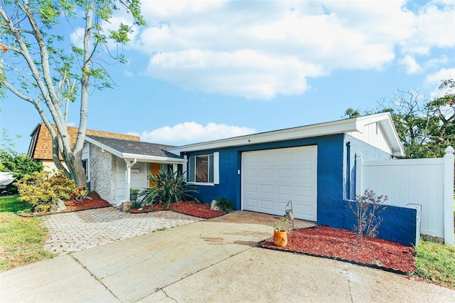 ranch-style home with a garage