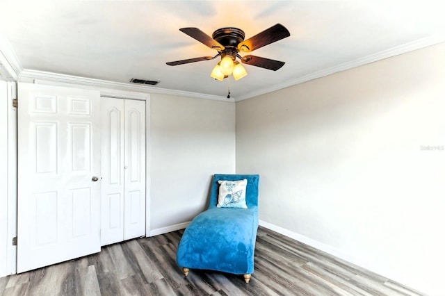 unfurnished room with wood finished floors, ceiling fan, baseboards, and ornamental molding