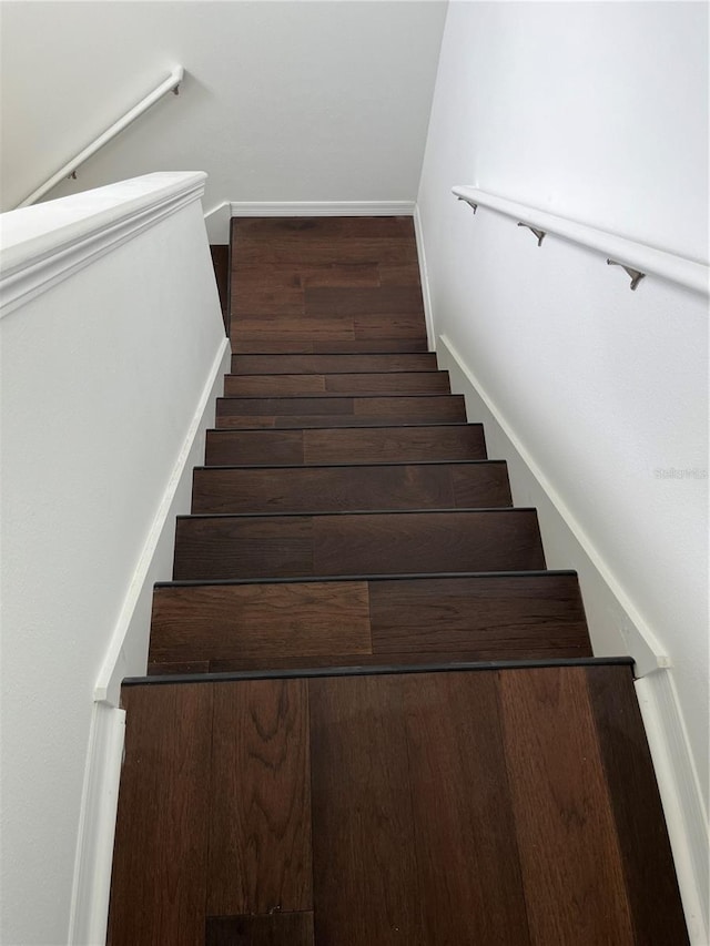 staircase featuring hardwood / wood-style floors