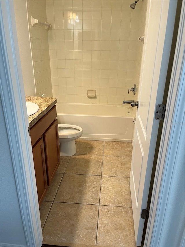 full bathroom featuring vanity, toilet, and tiled shower / bath