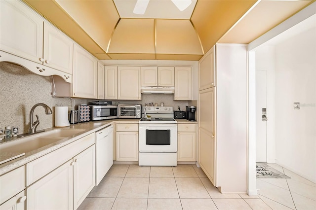 kitchen with ceiling fan, sink, light tile patterned floors, and white appliances