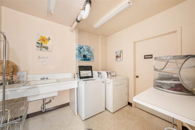 washroom with washing machine and clothes dryer