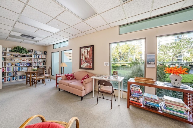 interior space with a paneled ceiling