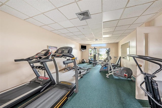 exercise room with a drop ceiling