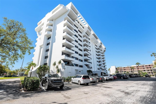 view of property with uncovered parking