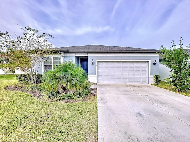 view of front of house featuring a garage and a front yard