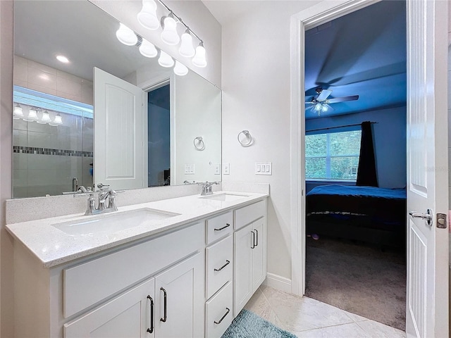 bathroom featuring tile patterned flooring, vanity, an enclosed shower, and ceiling fan