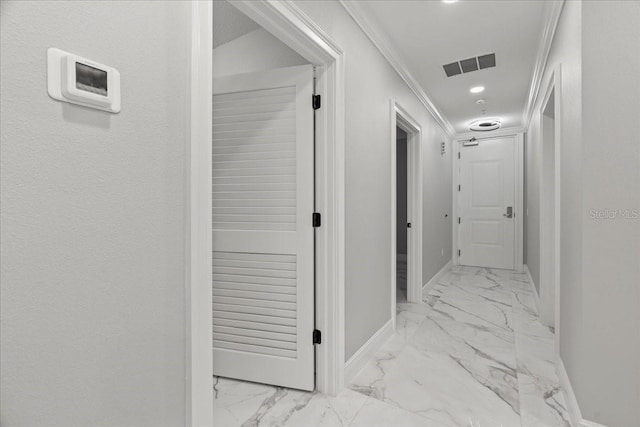 211 Dolphin Pt Unit 202, Clearwater Beach, FL 33767 - hall with marble look tiles, baseboards, ornamental molding, and recessed lighting
