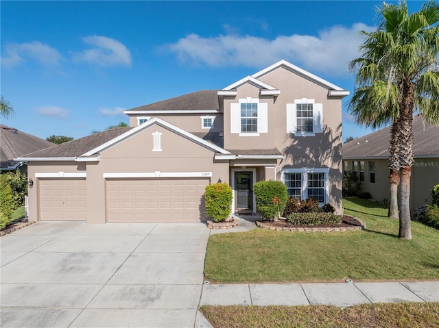 traditional home with stucco siding, an attached garage, driveway, and a front lawn