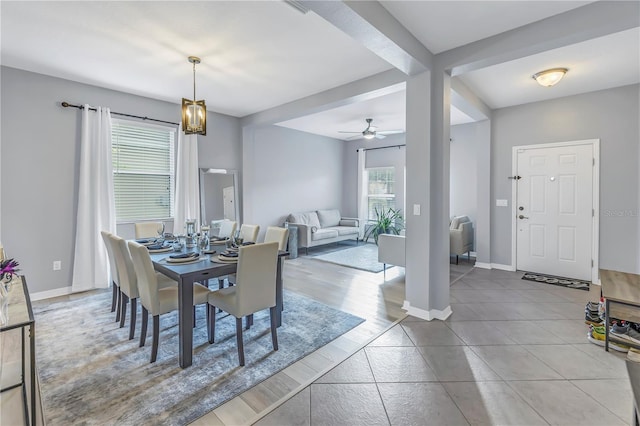 dining area with light hardwood / wood-style flooring and ceiling fan