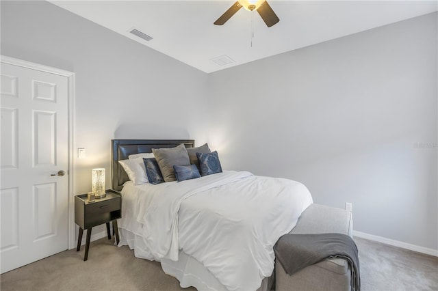 carpeted bedroom featuring visible vents, a ceiling fan, and baseboards