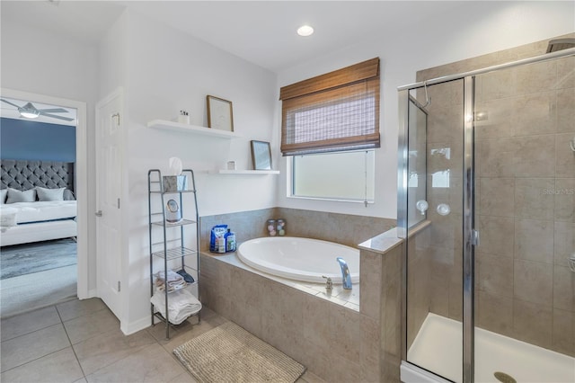 ensuite bathroom with connected bathroom, tile patterned floors, a garden tub, and a stall shower