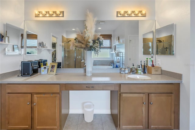 full bath with vanity, tile patterned flooring, a stall shower, and visible vents