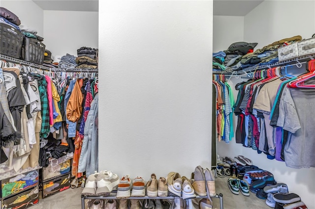 spacious closet with carpet