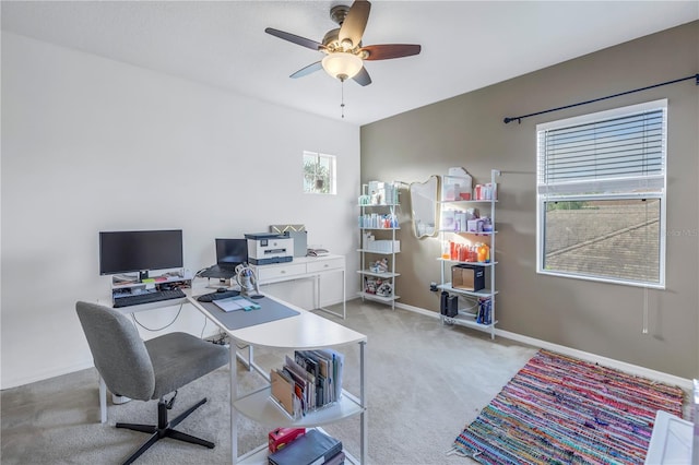 office with light colored carpet and ceiling fan