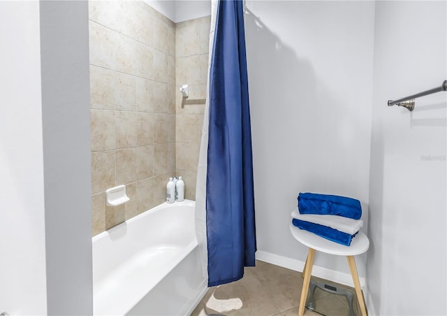 bathroom with shower / bath combo and tile patterned floors