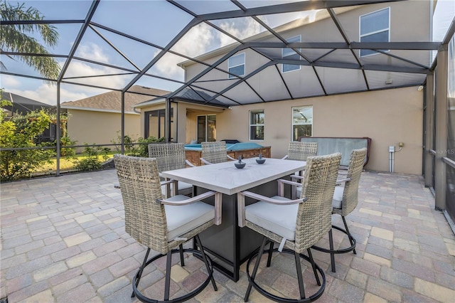 view of patio with glass enclosure