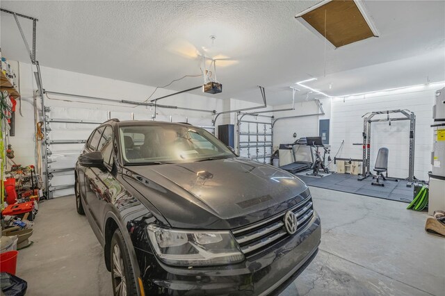 garage featuring a garage door opener and electric panel