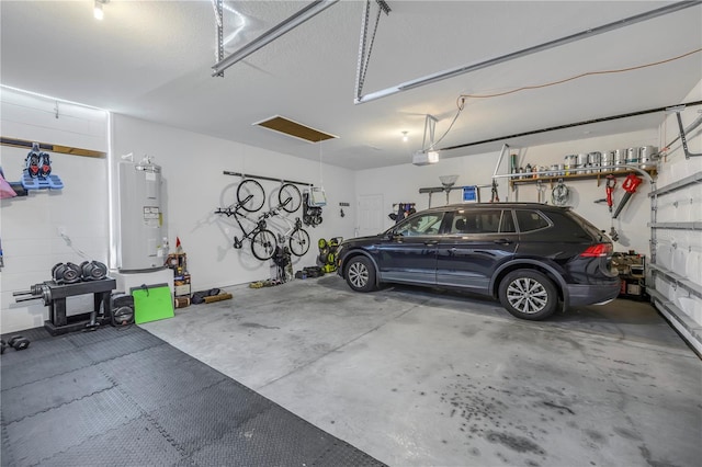 garage with a garage door opener and water heater