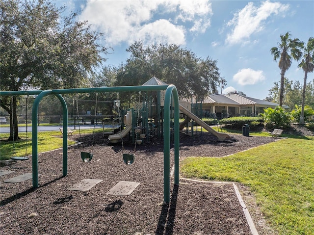 communal playground featuring a yard