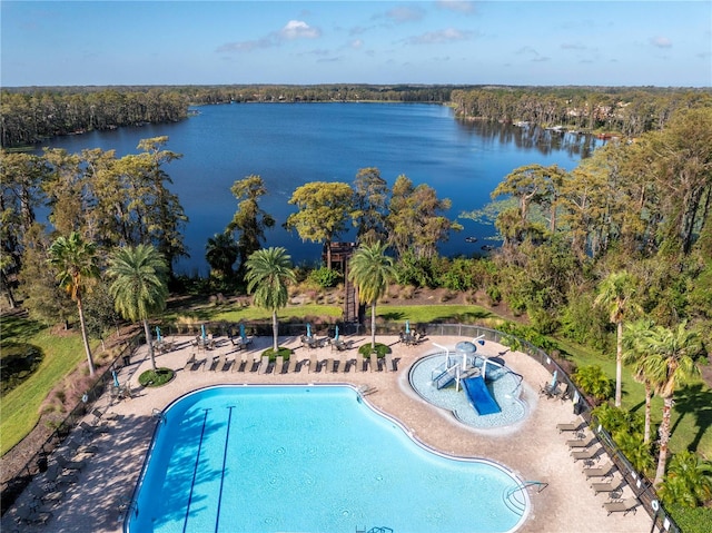 view of pool featuring a patio and a water view