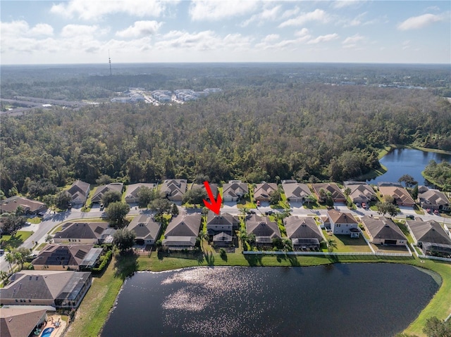 bird's eye view with a water view, a residential view, and a forest view
