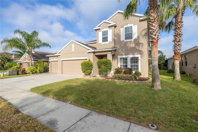 traditional home featuring an attached garage, a front lawn, stucco siding, and concrete driveway