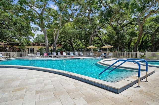 view of swimming pool featuring a patio area