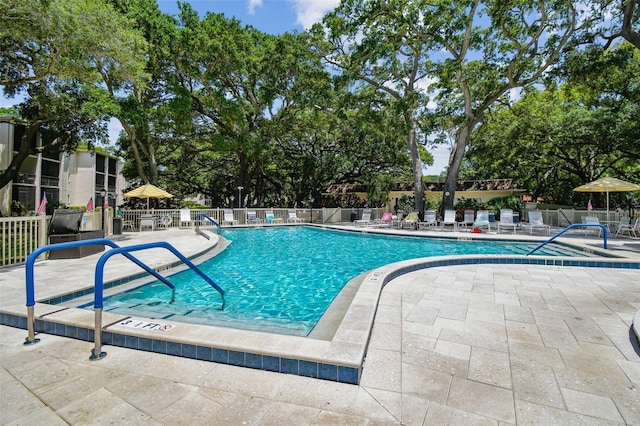 view of swimming pool with a patio area