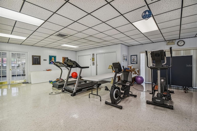 workout area with a paneled ceiling