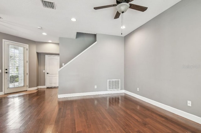 interior space with dark hardwood / wood-style floors and ceiling fan