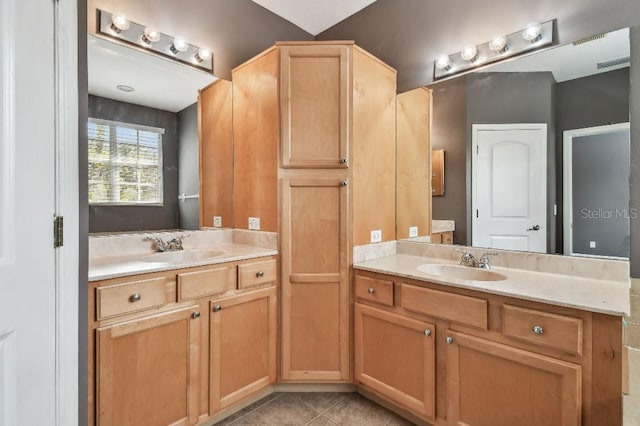 bathroom with vanity and tile patterned floors