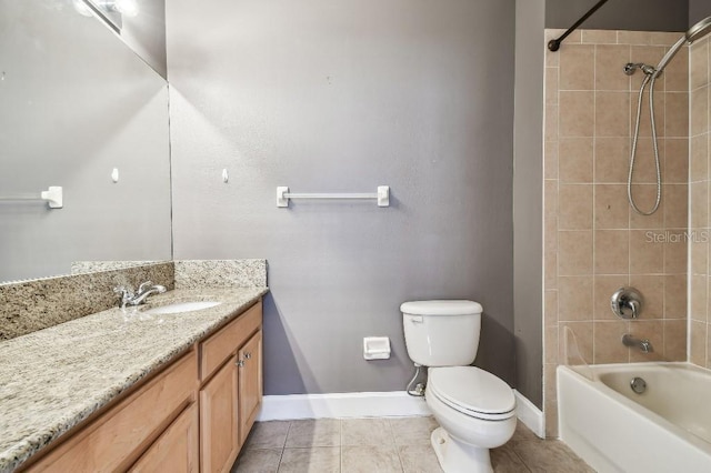 full bathroom featuring tile patterned floors, toilet, vanity, and tiled shower / bath