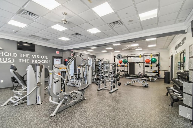 exercise room featuring crown molding, a drop ceiling, and ceiling fan