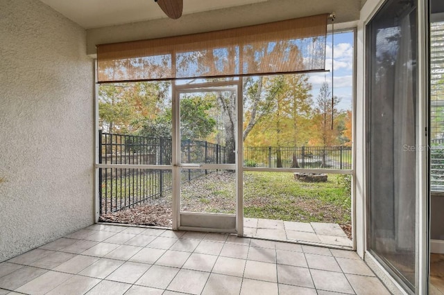 unfurnished sunroom featuring plenty of natural light