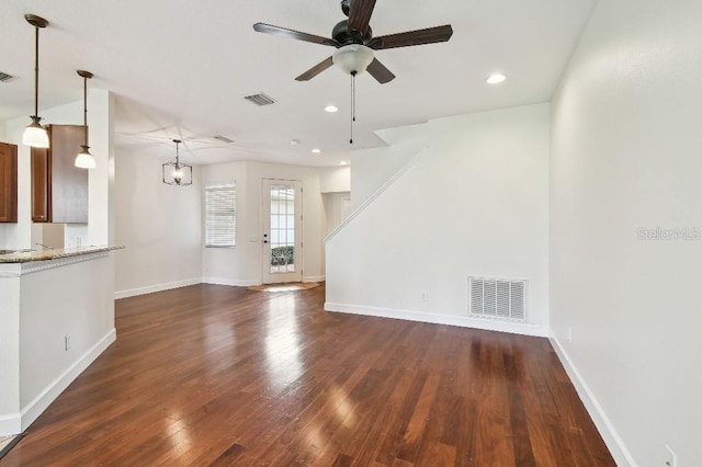 unfurnished living room featuring baseboards, visible vents, a ceiling fan, dark wood-style flooring, and recessed lighting